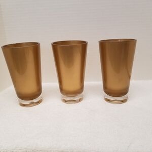 Three gold colored tumblers 6.5 inches tall only cold beverages